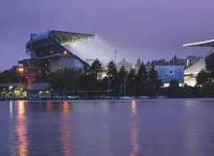 A view of the water and buildings at night.